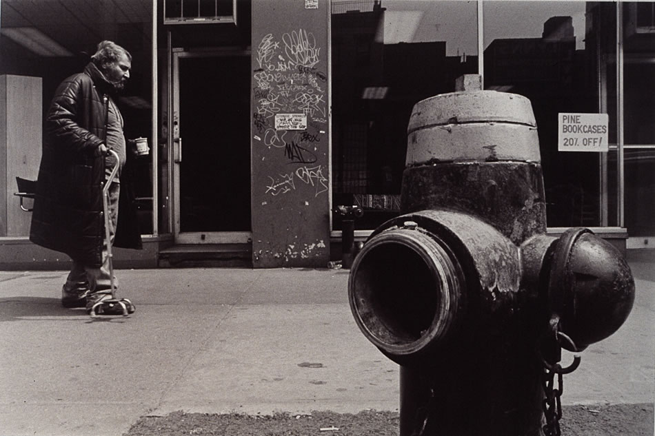 Street Photograph: Man walking by afire hydrant.